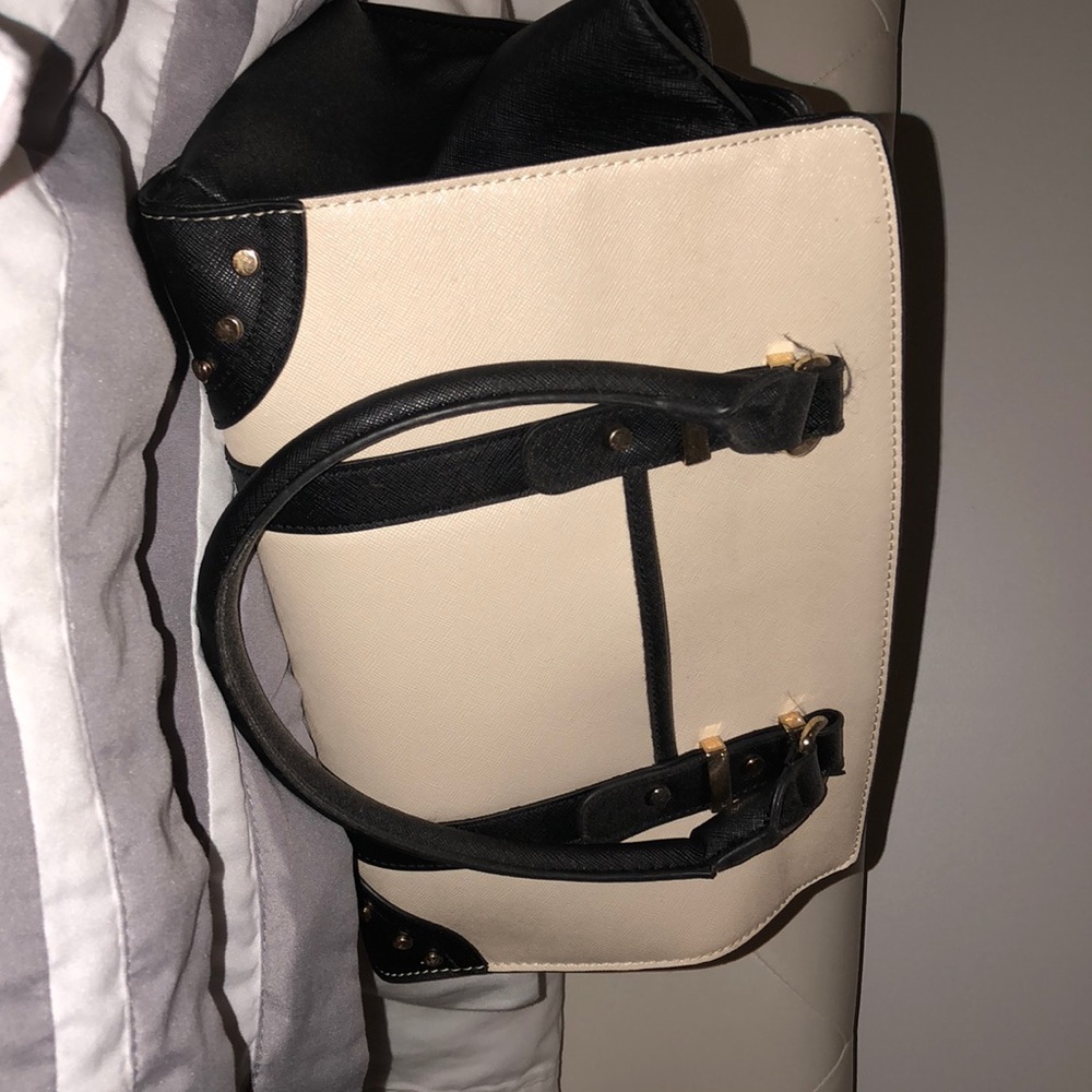 Off white handbag with black trim
